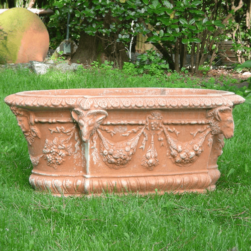 Flower box, apsis shape with rams. Decorations and garlands, reliefs in the style of the classical historical period of the pot. Handmade.