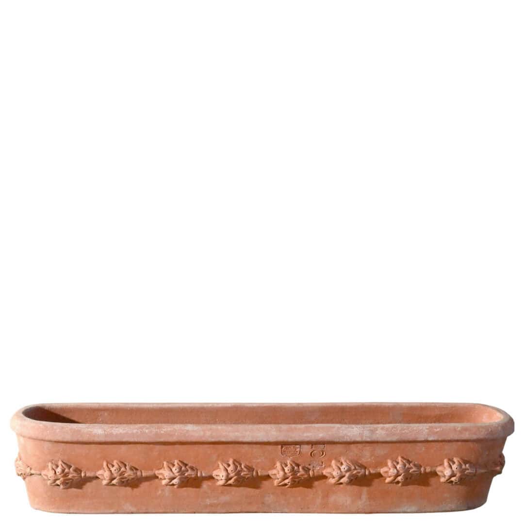 Cassetta da davanzale in terracotta con decorazione a frutta e foglie in rilievo, forma rettangolare