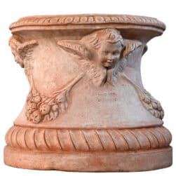 Base del Vaso a tortiglione in terracotta di Impruneta, con motivi a tortiglione, festone e mascherone centrale