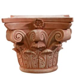 Corinthian capital in terracotta with carved acanthus leaves and lateral volutes