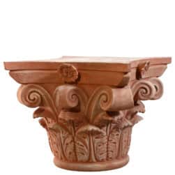 Corinthian capital in terracotta with carved acanthus leaves and lateral volutes
