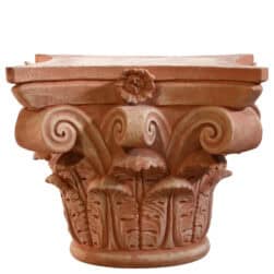 Corinthian capital in terracotta with carved acanthus leaves and lateral volutes