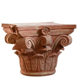 Corinthian capital in terracotta with carved acanthus leaves and lateral volutes