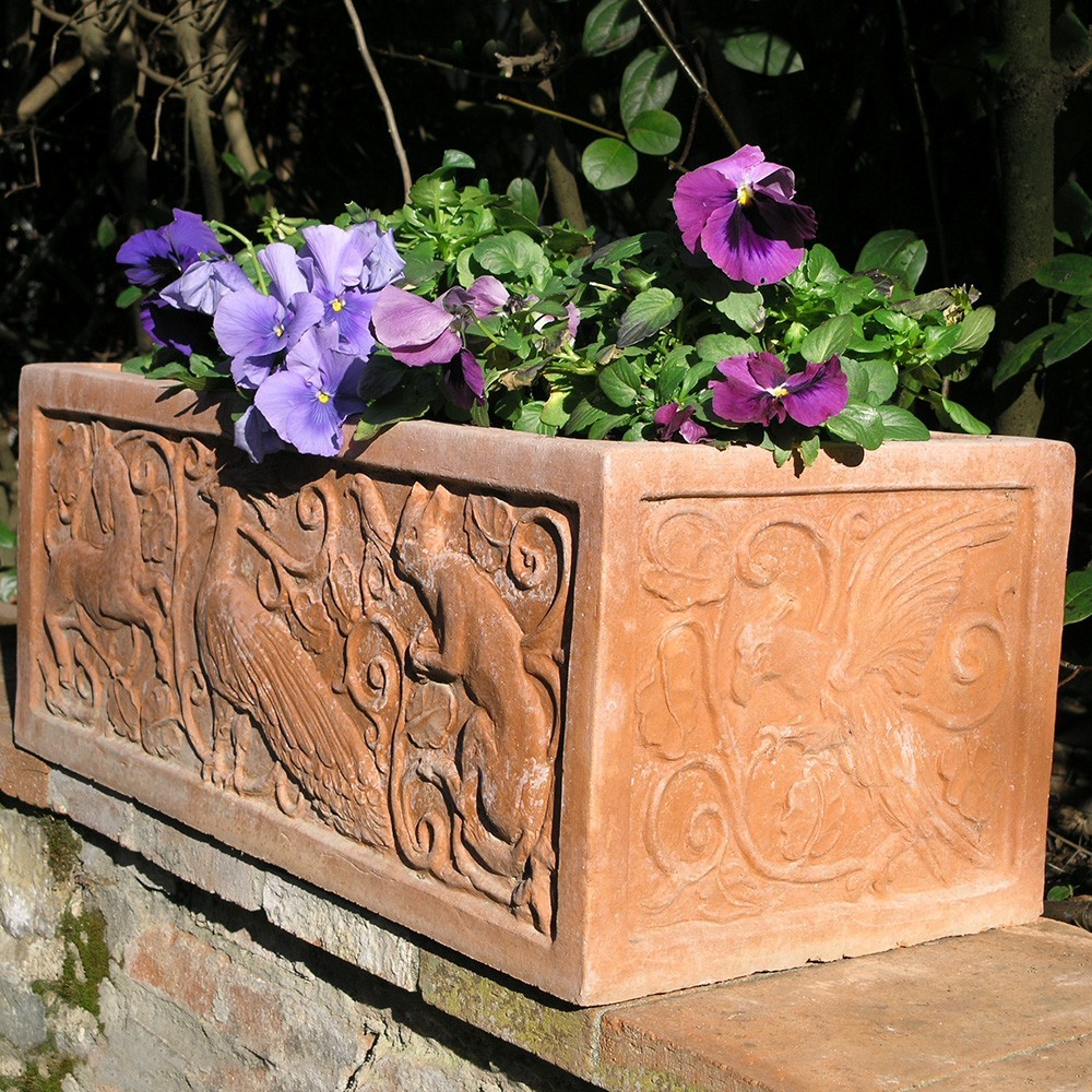 Flower box decorated in relief in the classic style of the vase era. Square or rectangular section shape. Handmade, frost resistant.