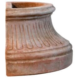 Fluted wall base in Impruneta terracotta, semicircular structure with vertical grooves and flat back for wall attachment.