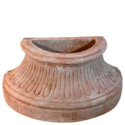 Fluted wall base in Impruneta terracotta, semicircular structure with vertical grooves and flat back for wall attachment.