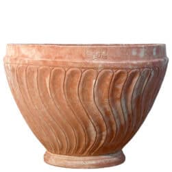 Terracotta wall planter with spiral-columned ribbed surface in half-moon shape