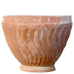 Terracotta wall planter with spiral-columned ribbed surface in half-moon shape