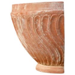 Terracotta wall planter with spiral-columned ribbed surface in half-moon shape