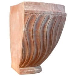 Terracotta wall planter with spiral-columned ribbed surface in half-moon shape