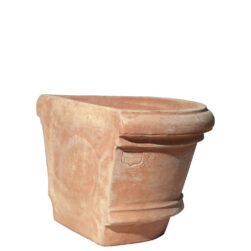 The Shallow wall pot with borders in terracotta, shaped like a half planter with decorative edges. Ideal for climbing plants. Perfect for terraces, gardens, and sidewalks.