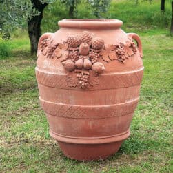 Festooned Relief Jar, suitable as a planter. Decorative element adorned with embellishments, pinecones, grapes, apples, pears, and lemons. Fruit in relief.