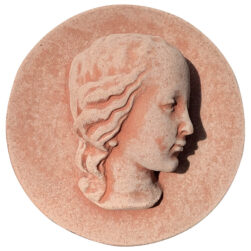 Terracotta panel with a high-relief face of Mary, featuring a serene profile and refined details, crafted from Impruneta clay.