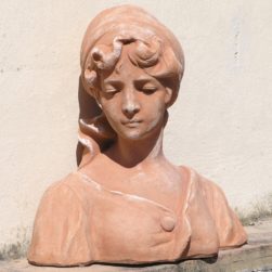 Classic statue depicting the bust of a young peasant woman. Modeling made in high relief. Handmade by master craftsmen. Frosty.