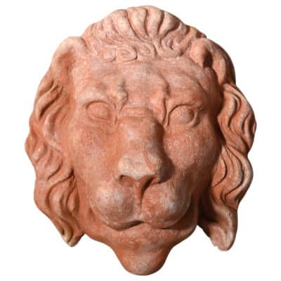 Terracotta Lion mask wall decoration stylized lion head for gardens and classical interiors
