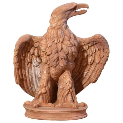 Handmade terracotta Eagle sculpture with partially spread wings on circular base for classical decoration