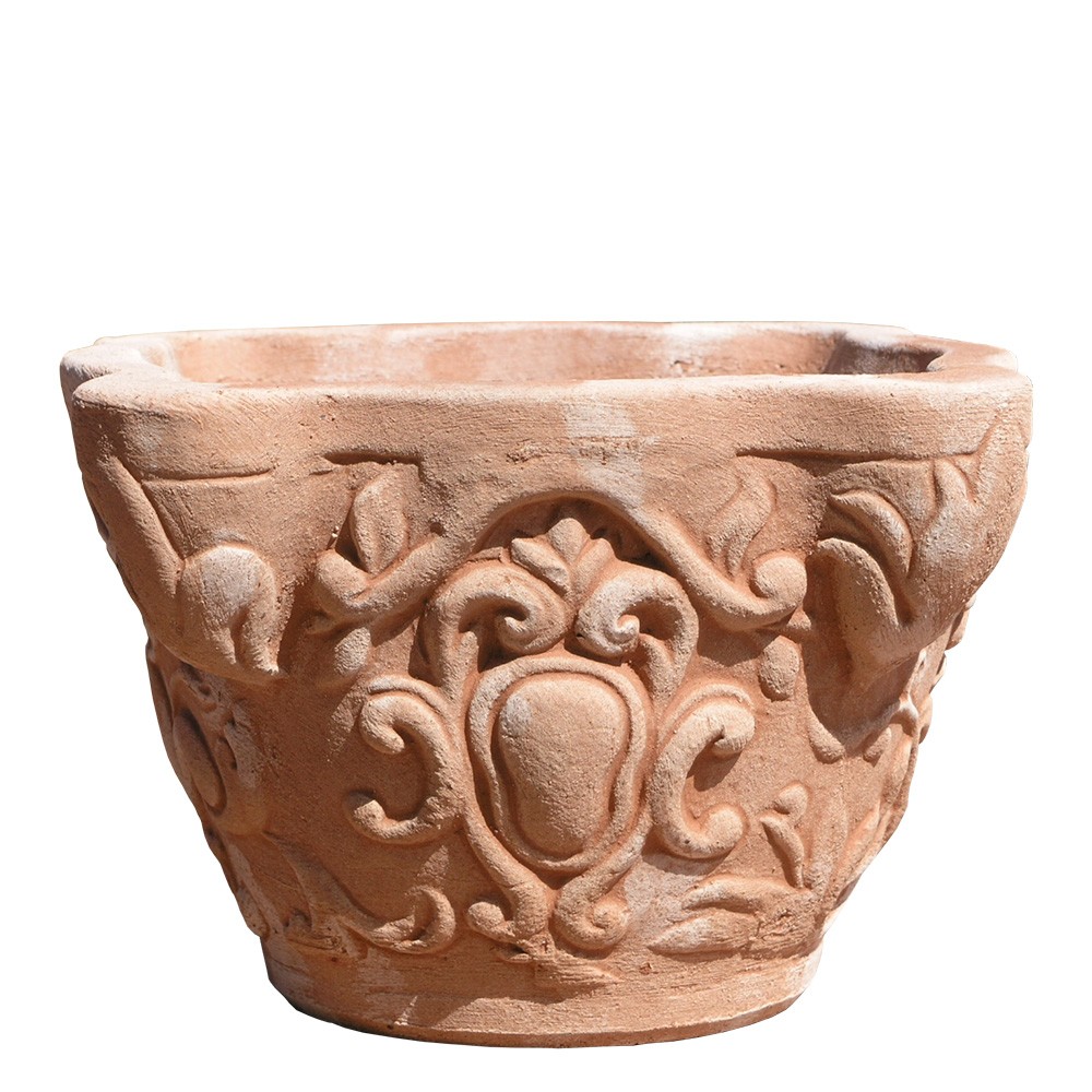 Jar with decorated capital. Flower box. Decorations and festoons, in relief in the classic style of the vase era. The good breathability of terracotta and thermal insulation give excellent health to the roots and plants. Accessories: Cassette, feet. Handmade by master craftsmen with frost-resistant Impruneta clay.