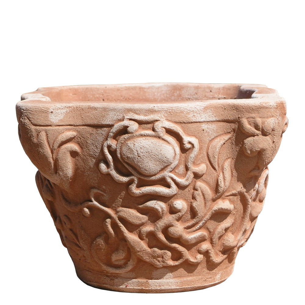 Jar with decorated capital. Flower box. Decorations and festoons, in relief in the classic style of the vase era. The good breathability of terracotta and thermal insulation give excellent health to the roots and plants. Accessories: Cassette, feet. Handmade by master craftsmen with frost-resistant Impruneta clay.