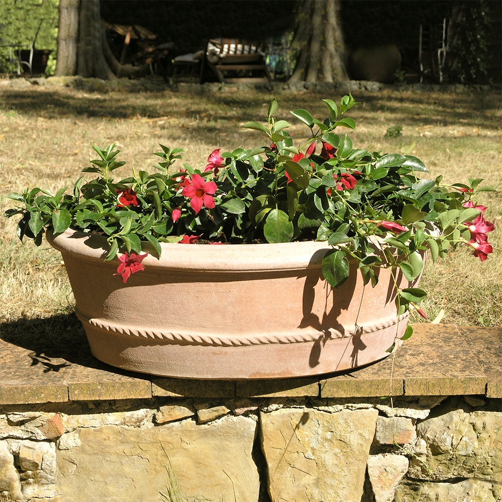 Oval plant pot with rim. Scalloped surface made in high relief. Handcrafted by master craftsmen, frost resistant.