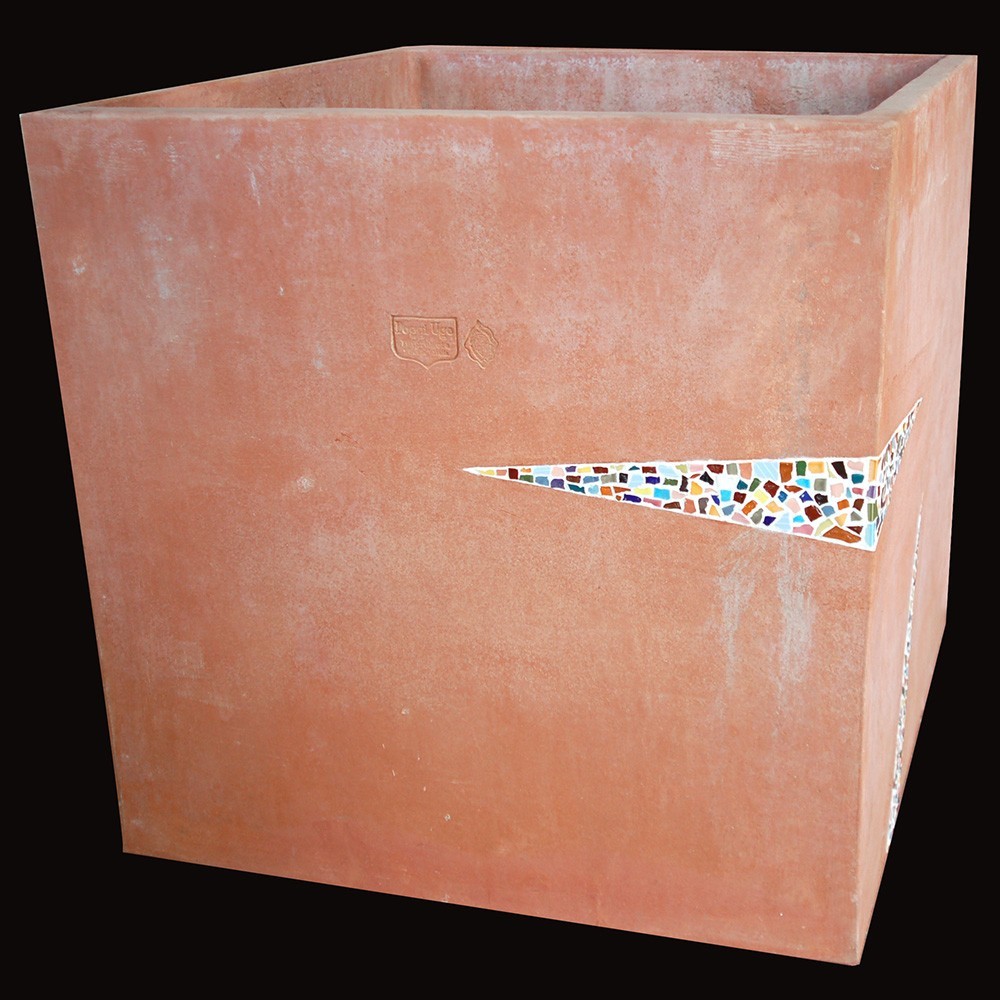 Handmade terracotta cube with glossy glazed ceramic mosaic inserts. Worked on three sides with inlays of different designs.
