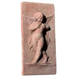 Terracotta relief panel with winged angel holding flutes, Renaissance-style decorative artwork