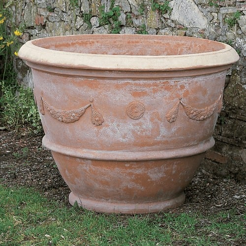 Terracotta festooned foot basin from Impruneta. Tuscan terracotta of the highest artisanal quality. Plant pot. Very elegant basin pot for classic garden.