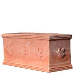 Rectangular terracotta planter box with three ivy leaves in relief on the front.