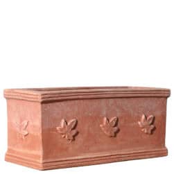 Rectangular terracotta planter box with three ivy leaves in relief on the front.