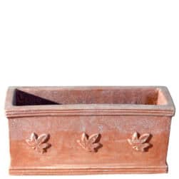 Rectangular terracotta planter box with three ivy leaves in relief on the front.
